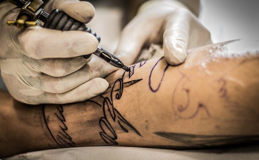 real estate agent getting a tattoo