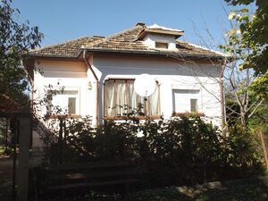 Country house with annex and land in big village near river