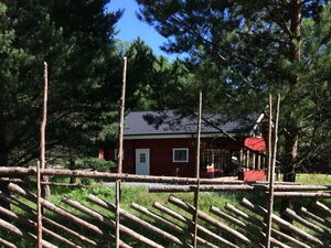 Log house with beachfront location