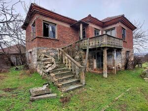 Two-story family house with a large yard in the border villa