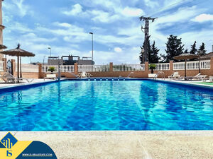 Second-floor bungalow with communal swimming pool