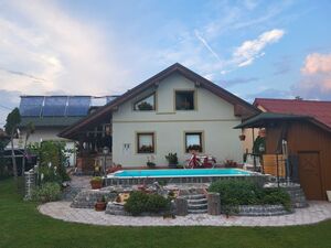 House in the middle of a green valley