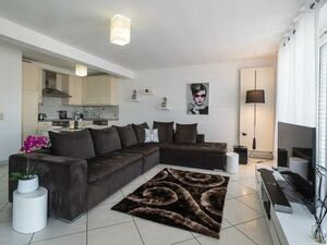    The apartment offers two bedrooms and a bathroom, 