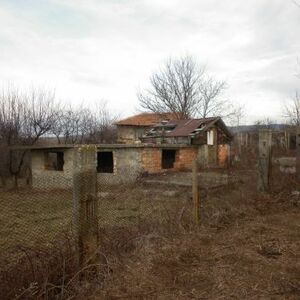 Rural property consisting of an uncompleted house,garage and a plot of land