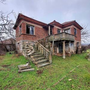 Two-story family house with a large yard in the border villa