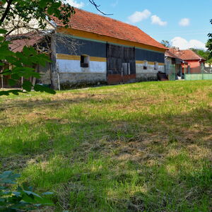 House and garden on the river side in Transylvania Retezat