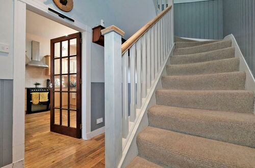 Stairs/backdoor hallway 